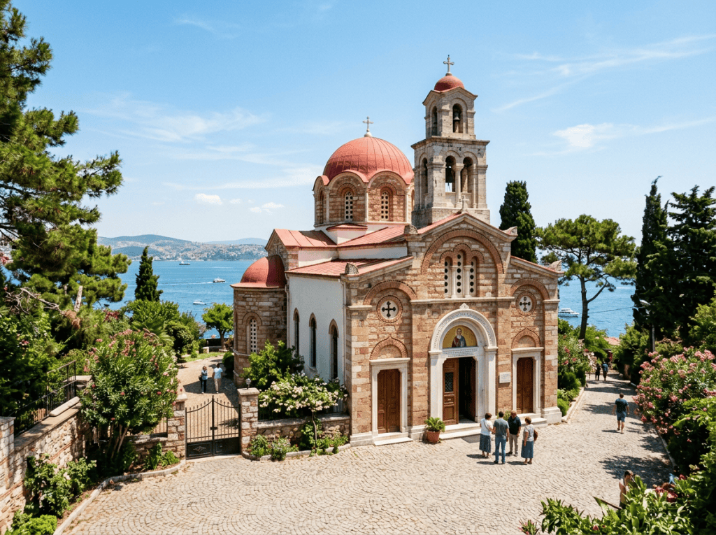 Orthodox church beside a blue bay with visitors and flowering gardens